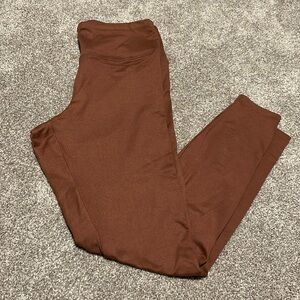 Rose gold/blush/taupe pink colored leggings from Express One Eleven collection.